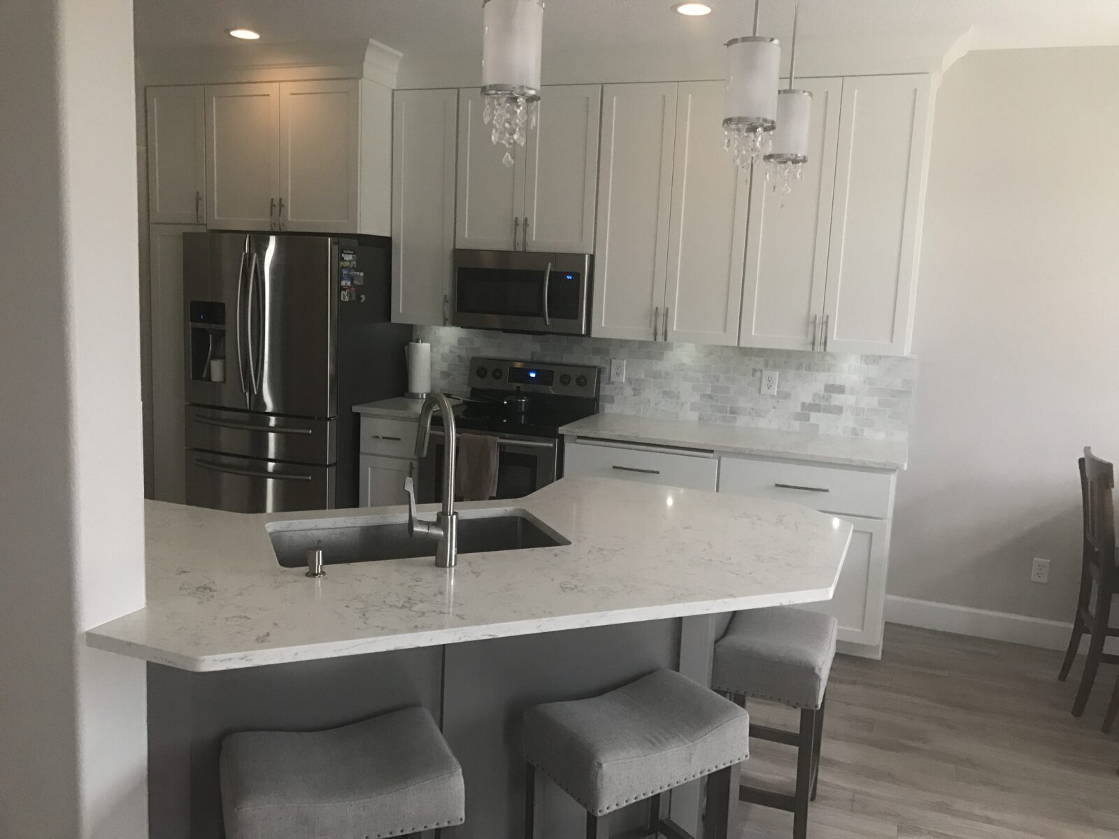 Contemporary Kitchen Remodel by VL Finishes Inc. project photo