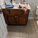 Old brown bathroom cabinet getting refinished