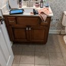 Old brown bathroom cabinet getting refinished